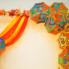 Placing umbrellas on the walls are attractive centrepieces for your mehndi or haldi celebration.