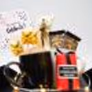 The striking black box is crafted with unique and meaningful items that will surely impress anyone