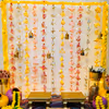 Click endless pictures of the Haldi and Mehndi ceremonies with vibrant and colourful hangings and backdrop decoration