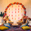 The brass lamps and pots filled with flowers make the Haldi event provide a traditional outlook