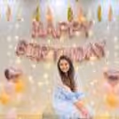 Birthday balloon decorations in rose gold and nude colors with pastel balloons