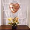 Your mother will love the elegant combination of flowers and balloons