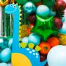 Celebrate another birthday year with dinosaur decor in green