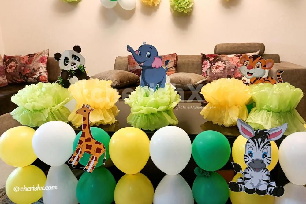 CherishX's Jungle Themed Birthday Decor includes wall and table decor with themed cut-outs.