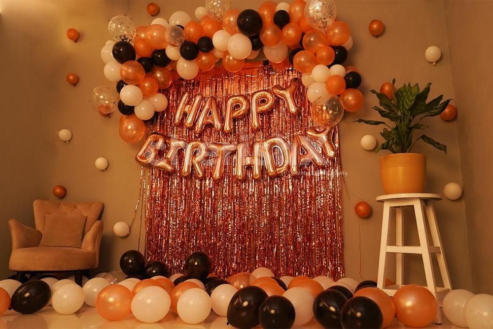 Rosegold Frill Curtains and Black, White Balloons add an elegant look to the decor.