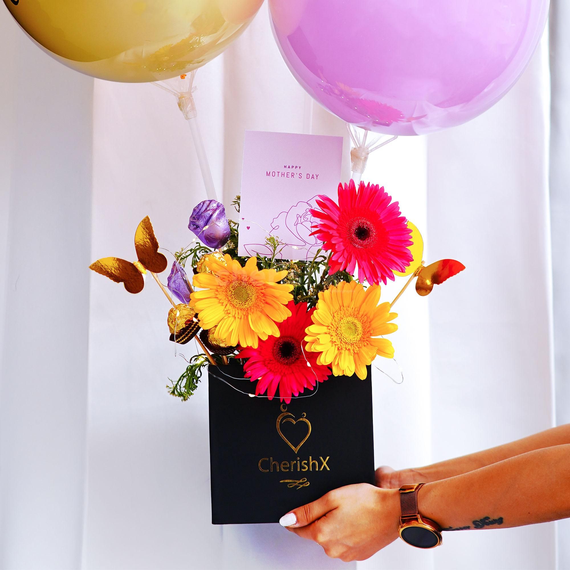 Your mother would love to indulge in our sweet Ferrero Rocher surprise added to the bucket.