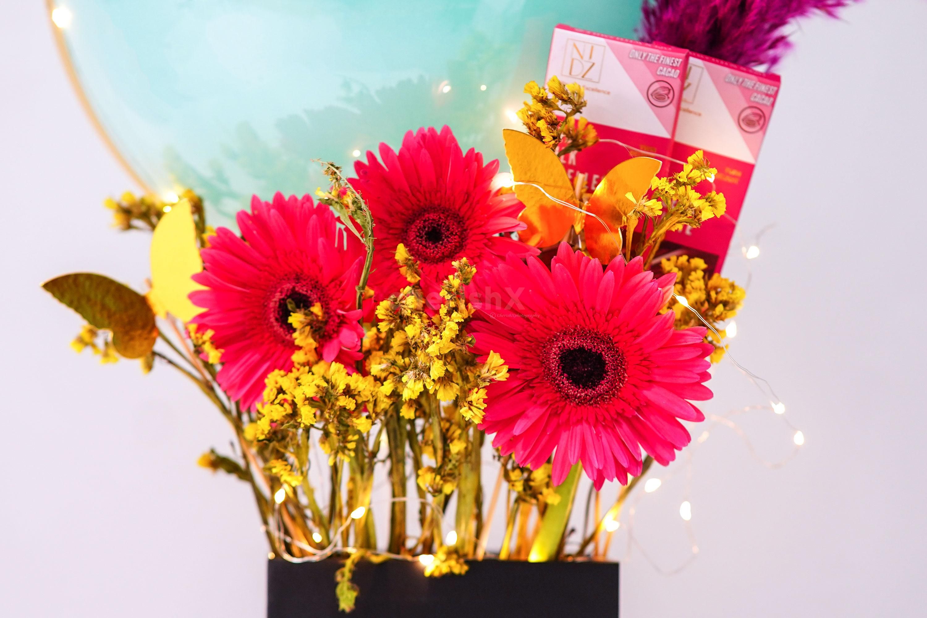 Your mother will love the sweet butterflies added as décor to the bucket