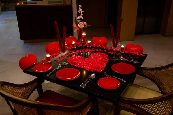 The dim light created by the candles sets the mood for a romantic and intimate evening