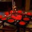 The dim light created by the candles sets the mood for a romantic and intimate evening