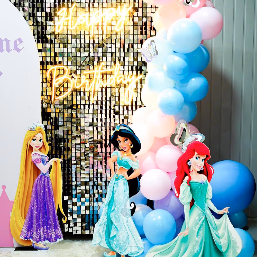 The pastel-coloured balloons add a whimsical touch to the venue.