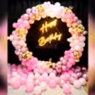 Get a 'Happy Birthday' Neon Light Sign with Pink Balloon Arch.