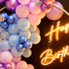 The multi-colored balloon arch is the perfect room and rooftop birthday decoration idea.