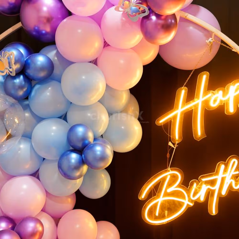 The multi-colored balloon arch is the perfect room and rooftop birthday decoration idea.
