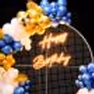Celebrate surrounded by the royal balloon backdrop adorned with a blend of Golden Chrome, Blue chrome and White Latex.