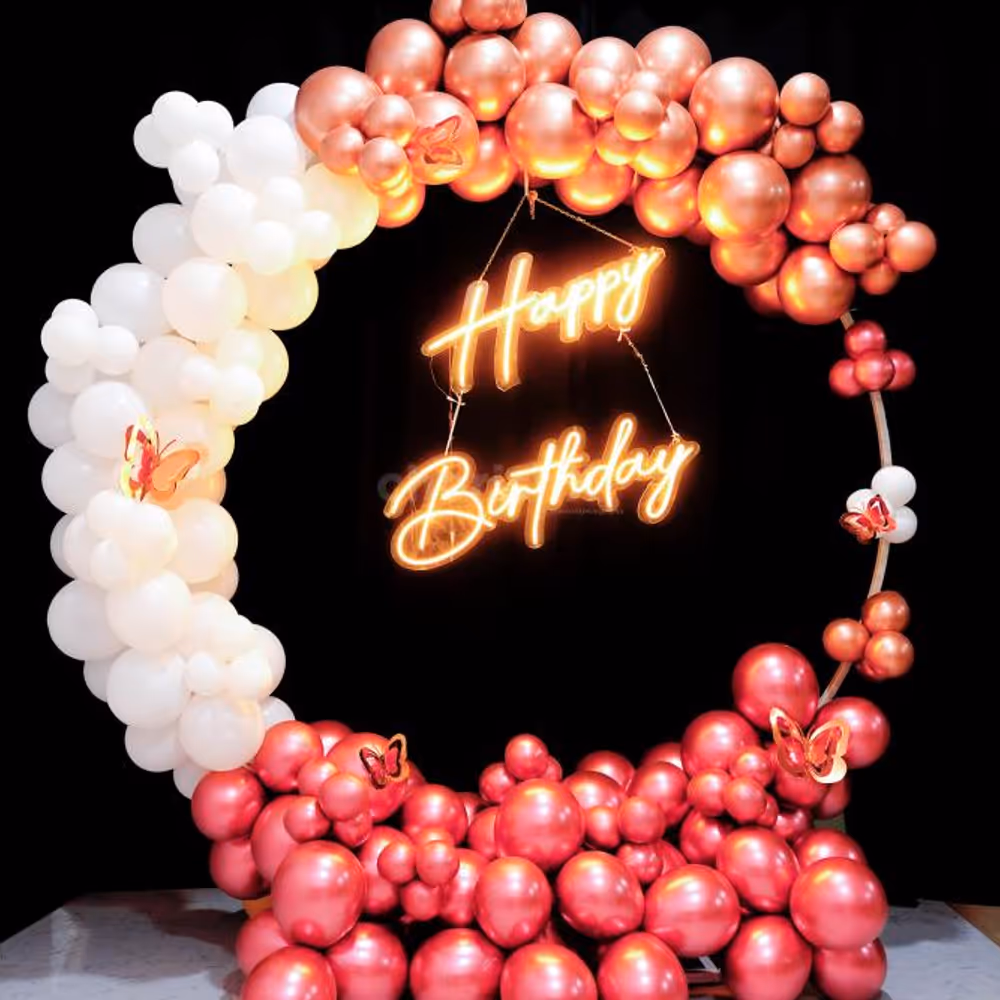 Add a touch of magic to your special day with our stunning rose gold and white balloon backdrop.