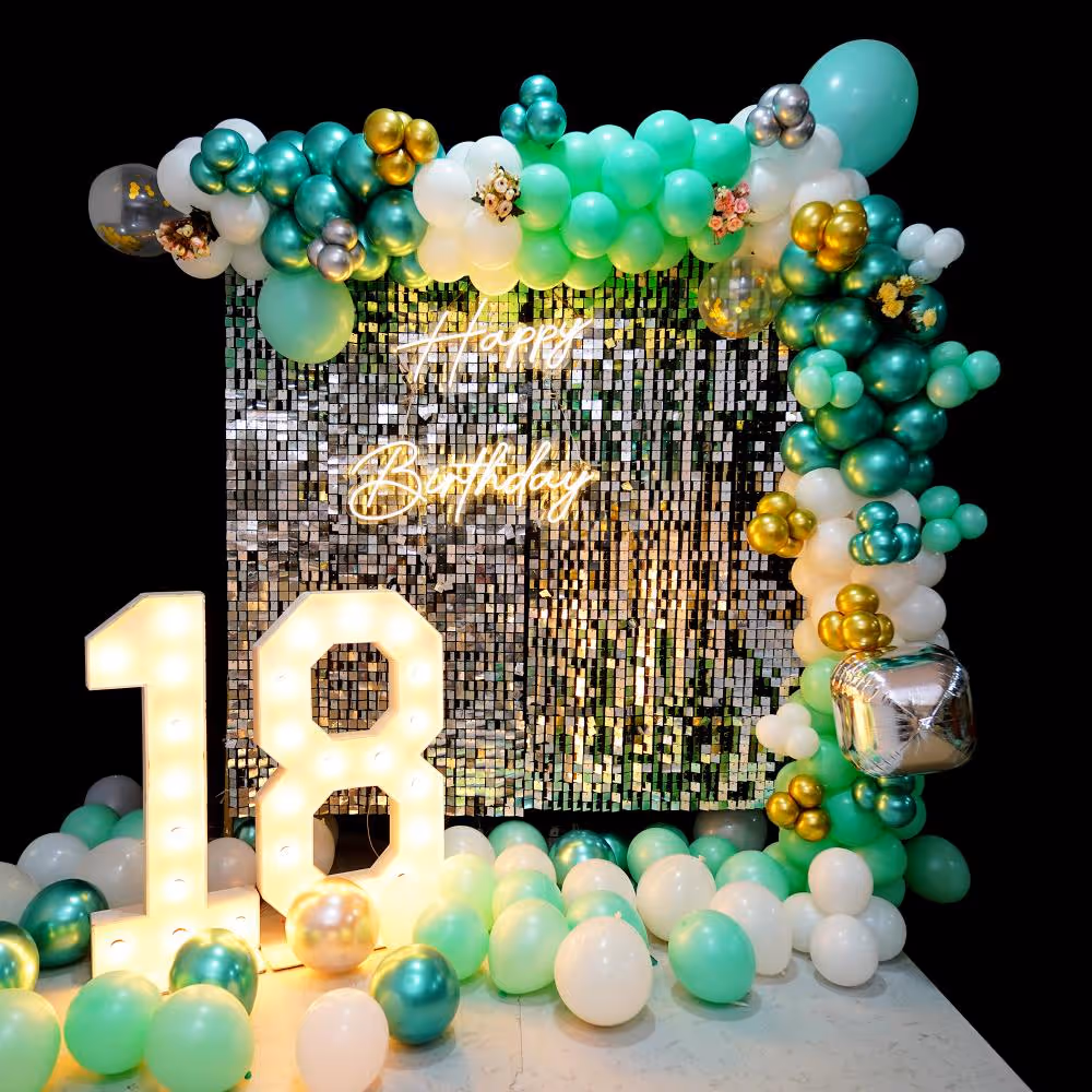 Golden hues and whimsical balloons make for the perfect birthday celebration decor.