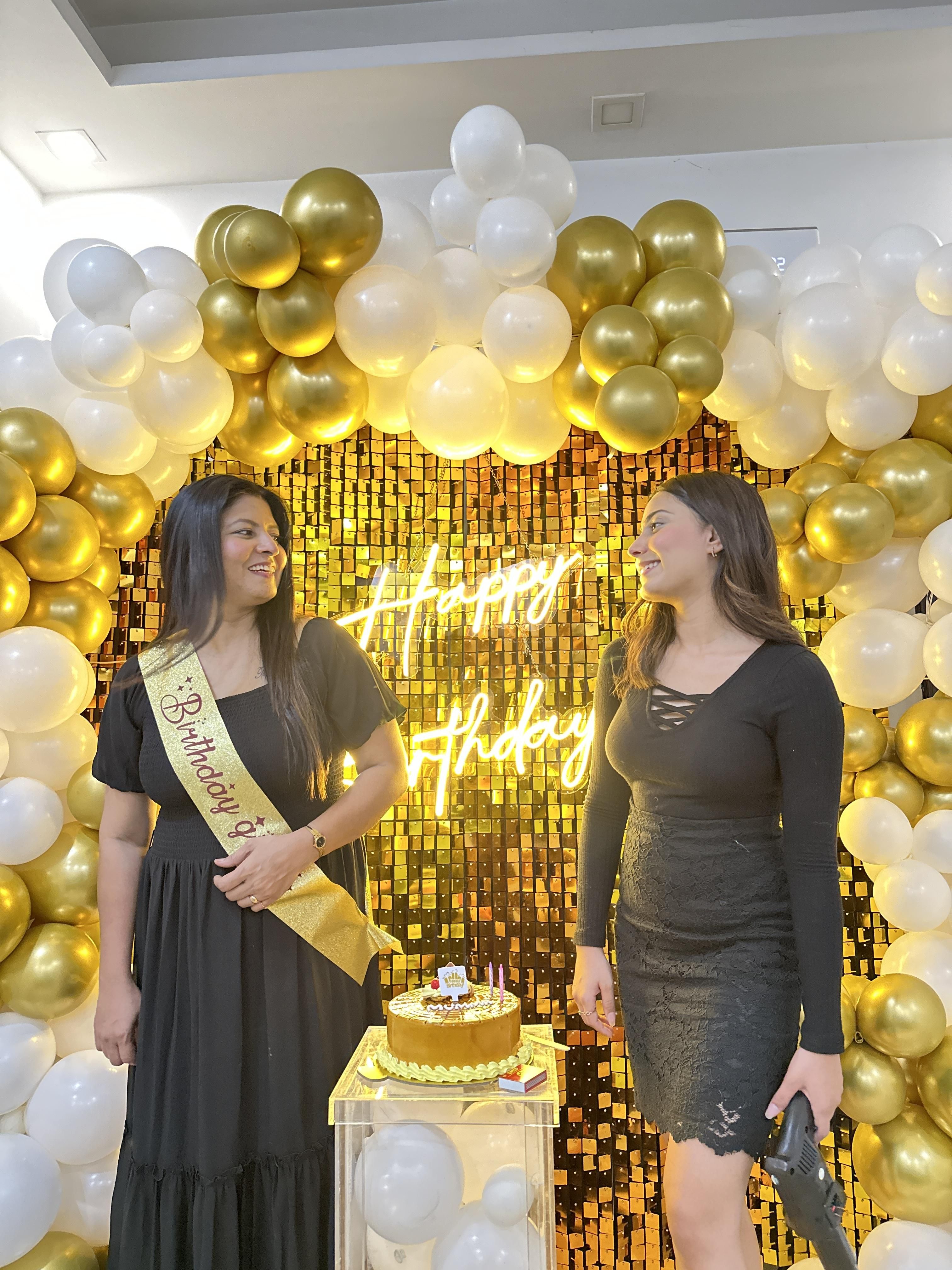 Make a statement with this golden sequin backdrop for your birthday party.