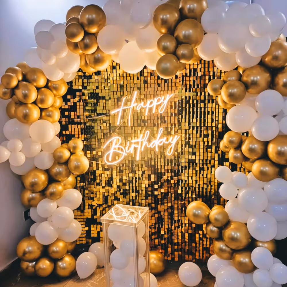 Make a statement with this golden sequin backdrop for your birthday party.