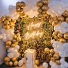 Make a statement with this golden sequin backdrop for your birthday party.