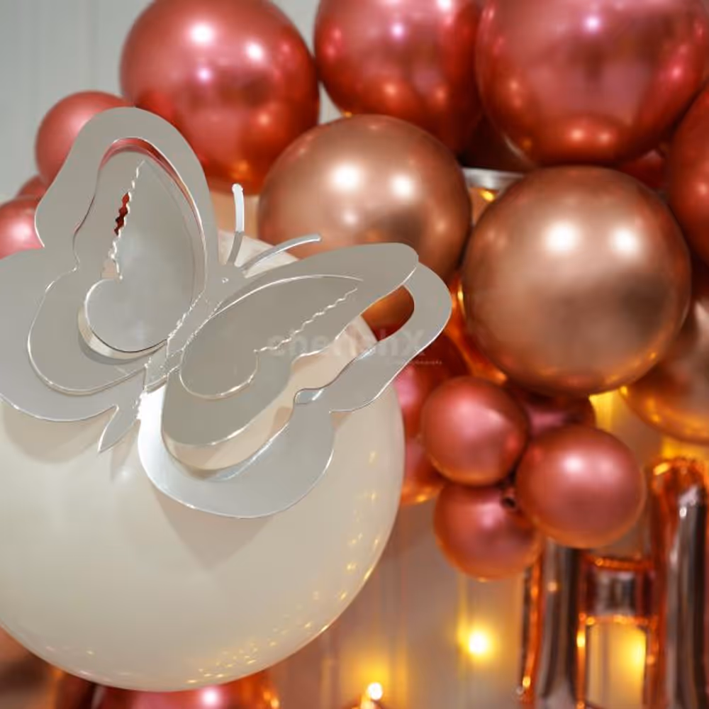 A Birthday Delight adorned with Rose Gold and Pink Chrome Balloons.