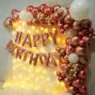 Happy Birthday foil balloons float gracefully in the air, their vibrant colours adding a cheerful touch to the celebration.
