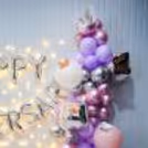 Step into a dreamy wonderland adorned with captivating balloons and a sprinkling of confetti, perfect for your anniversary celebration.