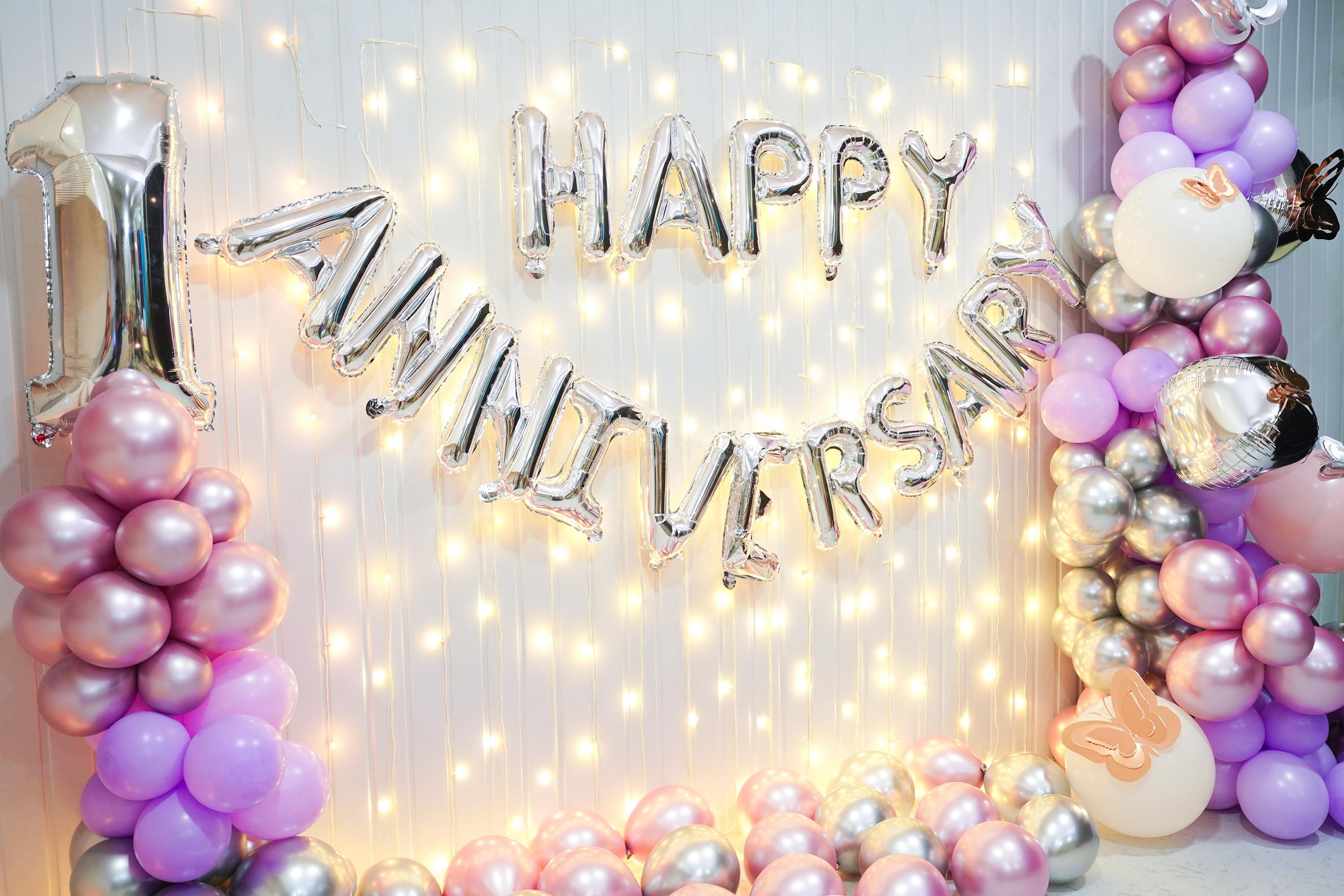 Immerse yourself in a symphony of colors with a delightful combination of Purple pastel, chrome pink, and Chrome Silver Purple latex balloons, beautifully complemented by delicate rose gold butterflies.