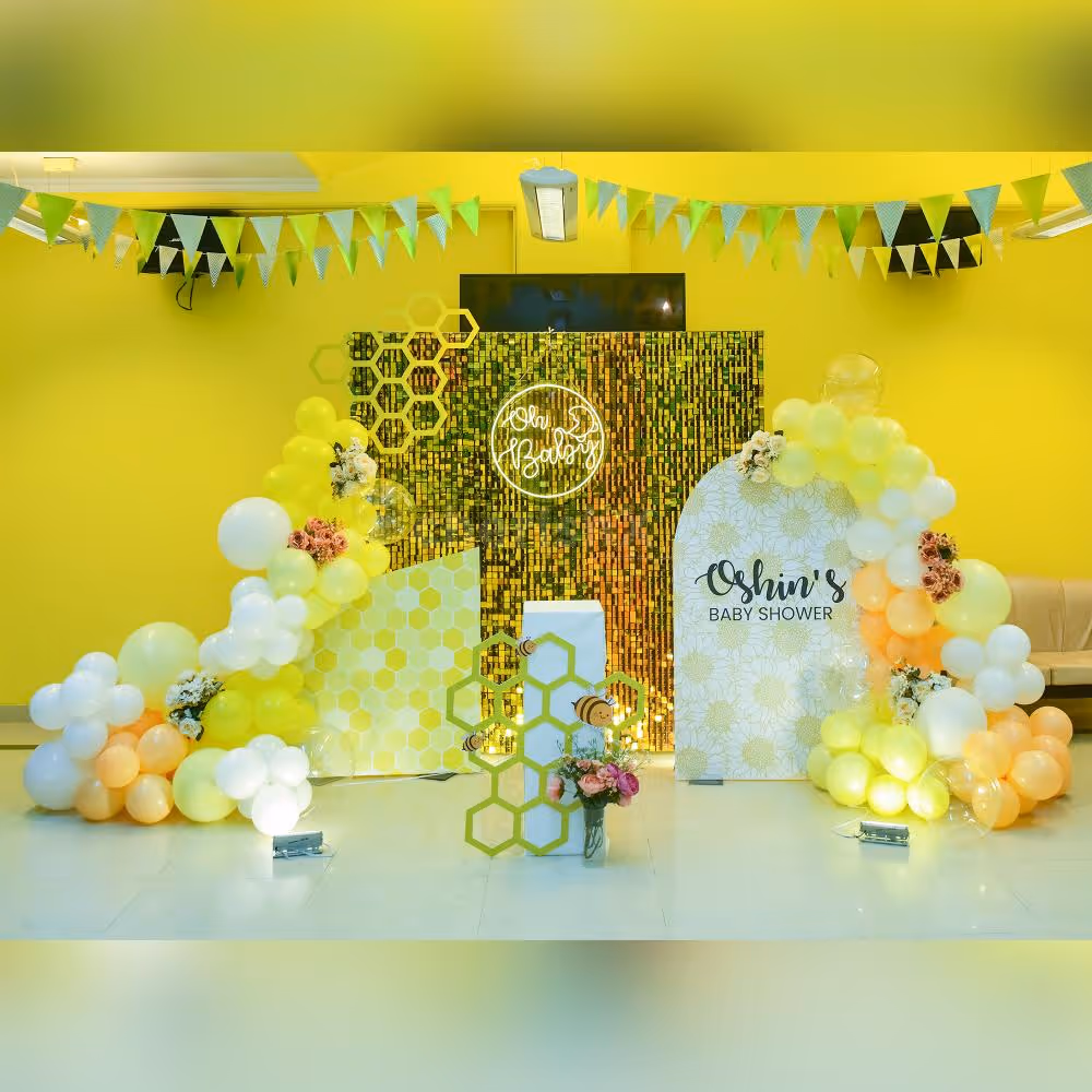 A touch of balloon-filled joy with flower bunches gives a unique touch to the decoration.