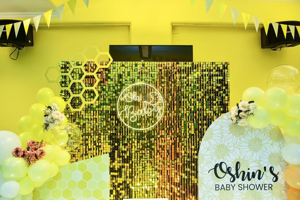 The blend of dazzling sequin backdrop, adorable honeycomb cutouts, and a burst of colourful balloons will make your celebrations lively.