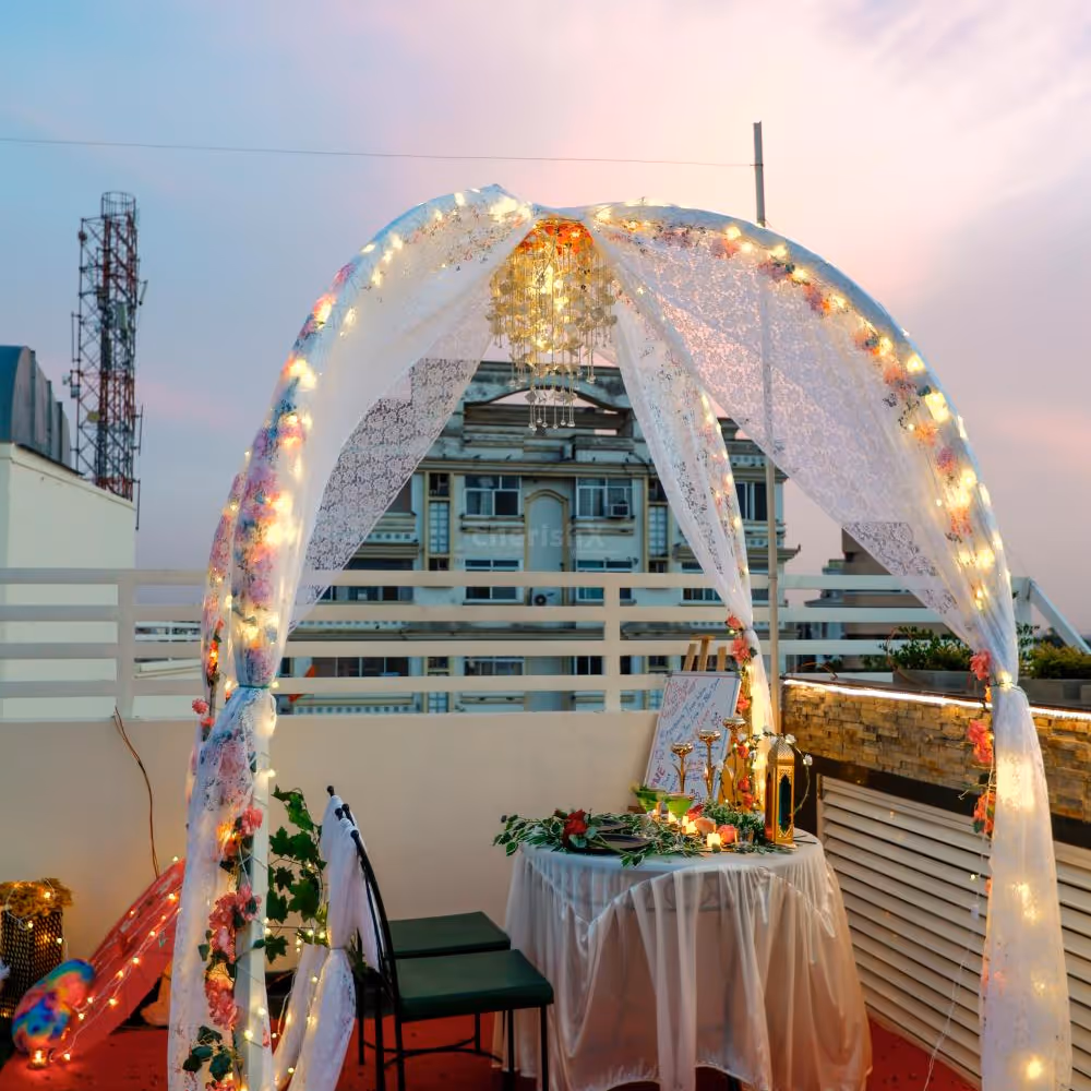 The table is artfully decorated with a cascade of vibrant blooms, adding a touch of natural beauty to your candlelit affair.