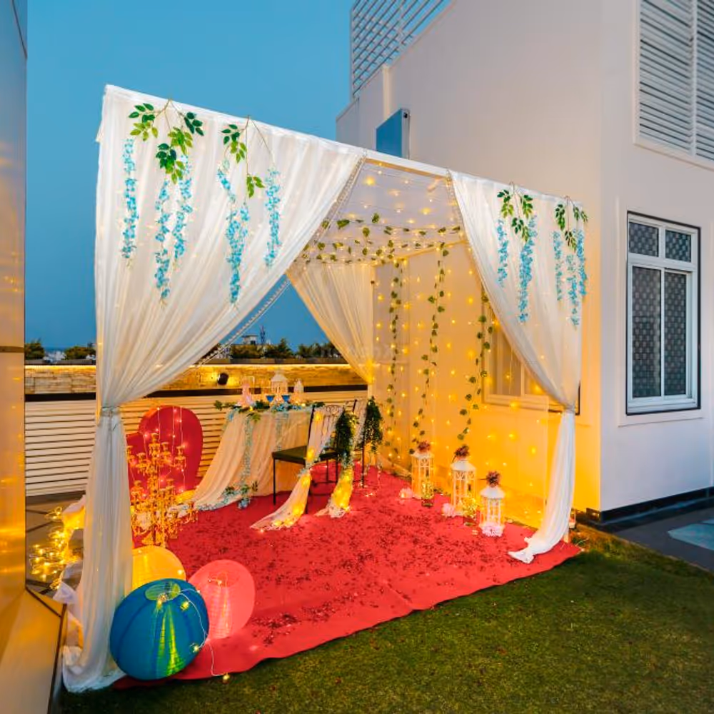 The table is artfully decorated with a cascade of vibrant blooms, adding a touch of natural beauty to your candlelit affair