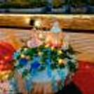 The table is beautifully adorned with a sea of delicate flower petals, creating a stunning visual spectacle.
