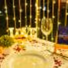 The flower petals and tea candles adorn the table, setting the stage for a truly magical evening.