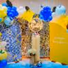 Experience the blissful ambience of our dreamy baby shower celebration, surrounded by the soothing hues of blue, yellow, and white balloons.