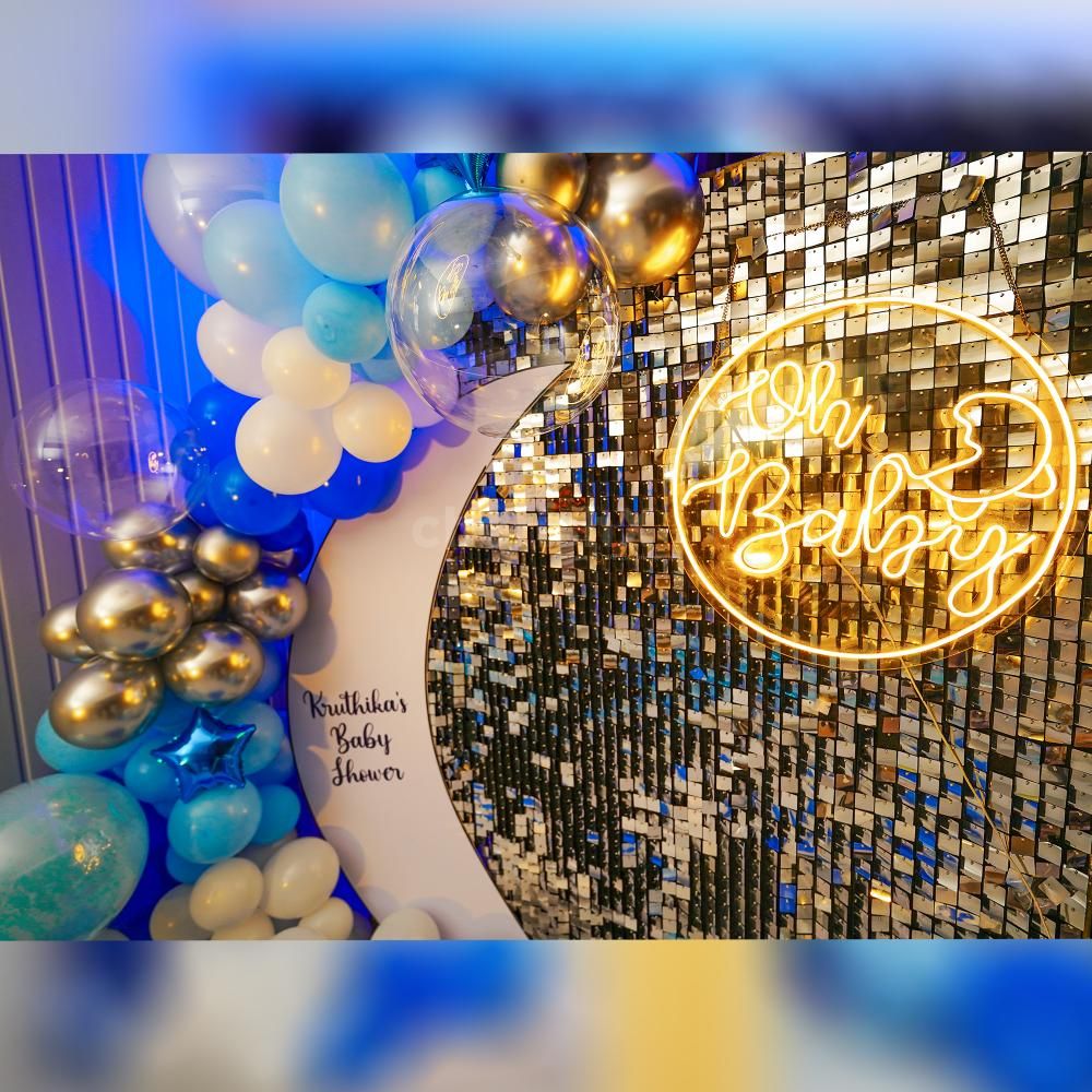 The artistic arrangement of transparent bubble balloons adds an ethereal touch.