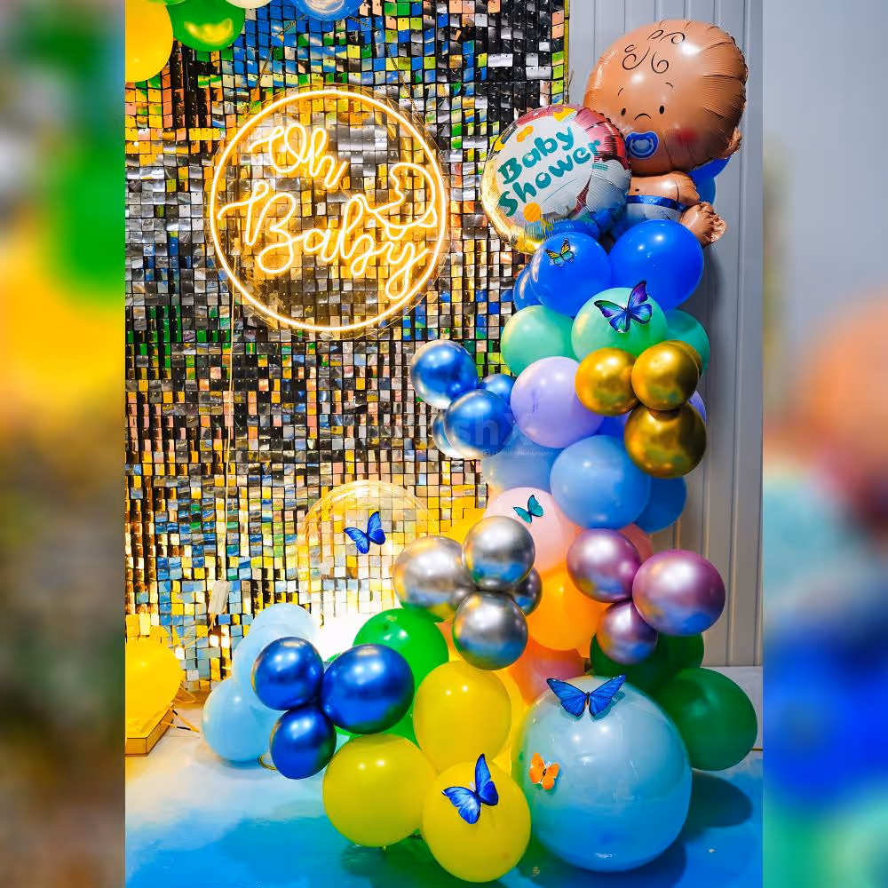 Indulge in the beauty of a rainbow-inspired backdrop, adorned with a burst of balloons in various shades.