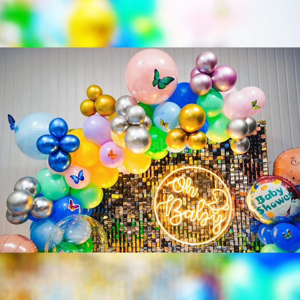 The burst of colourful balloons against the backdrop creates an enchanting and playful ambience that is sure to bring smiles to everyone's faces.