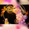 Golden Leaves and balloons embrace Nature's Beauty in Pastel baby shower decorations.