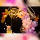 Golden Leaves and balloons embrace Nature's Beauty in Pastel baby shower decorations.