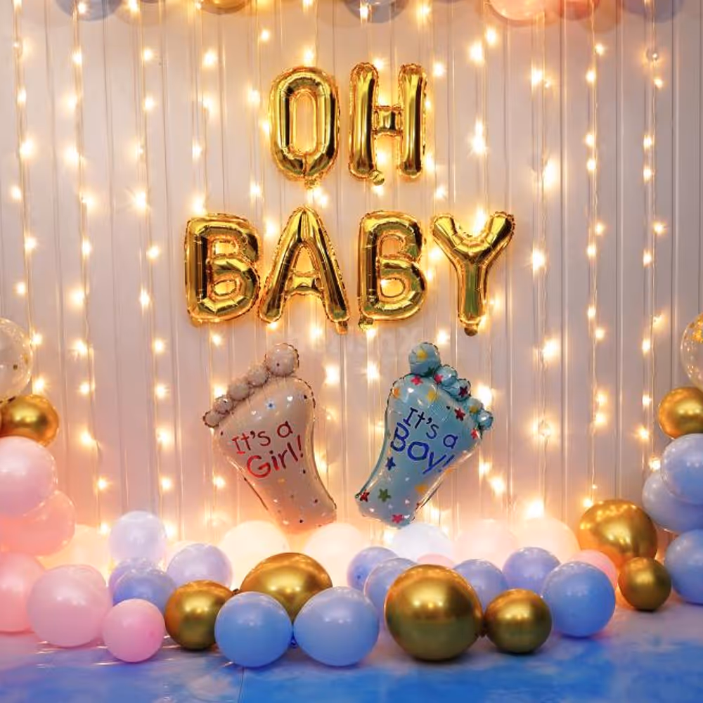 Gold confetti with pastel-coloured balloons makes a wonderful baby shower backdrop.