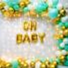 The combination of golden balloons with green balloons evokes a sense of elegance, nature, and excitement.