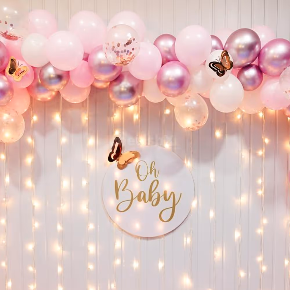 Experience the Charm of Rosy Whispers as Pastel Pink Balloons and Gold Butterflies.