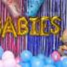 Experience the Delightful Vibe with a balloon backdrop and foil balloons.