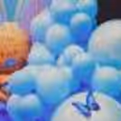 An arch of pink and blue balloons together make the evening picture perfect
