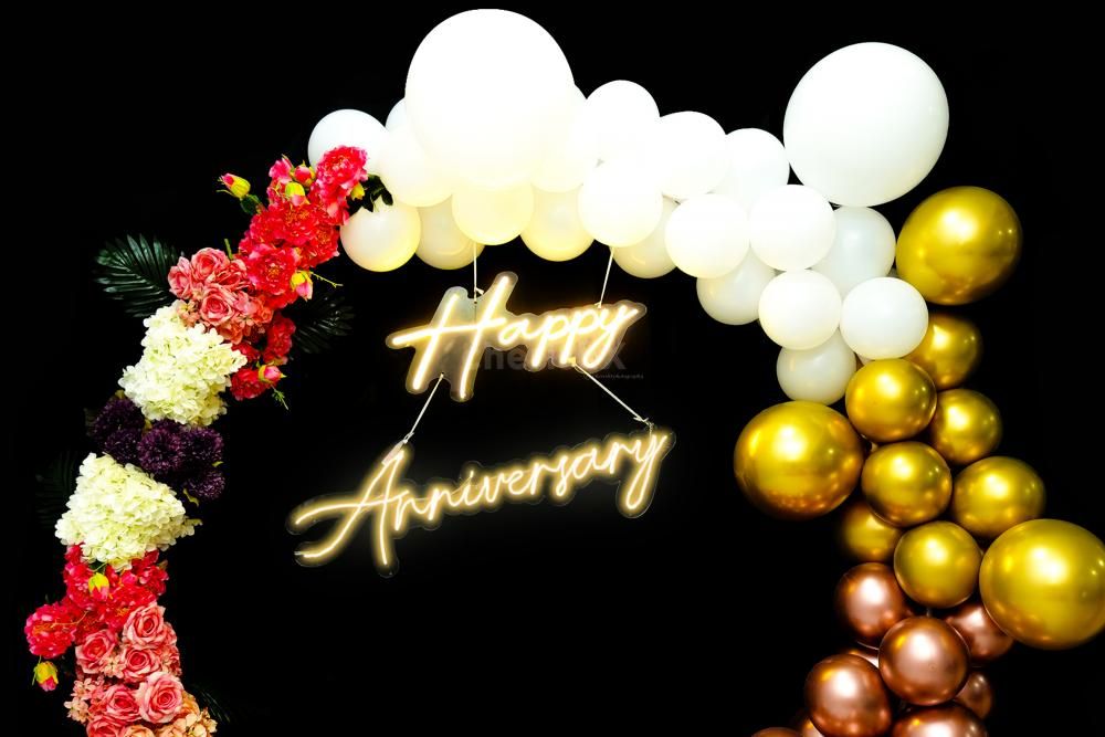 Captivate Your Partner's Heart with the complete ring decoration with a neon light stating "Happy Anniversary