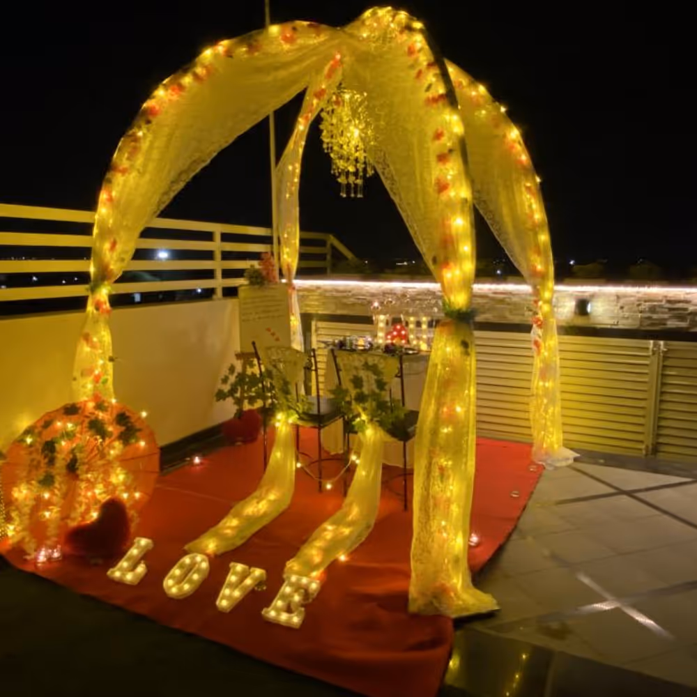 The table is beautifully adorned with a sea of delicate flower petals, creating a stunning visual spectacle.