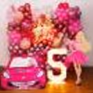 Mesmerizing balloon backdrop comes with pink, white, and magenta-coloured hues.