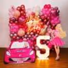 Glamorous foil balloon accents add more pop to the kid's birthday celebrations.