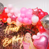 Eye-catching disco foil balloons add an extra dose of glitz and glamour.