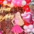 Iconic macron balloons in white and pink add that classic Barbie touch to the party ambience